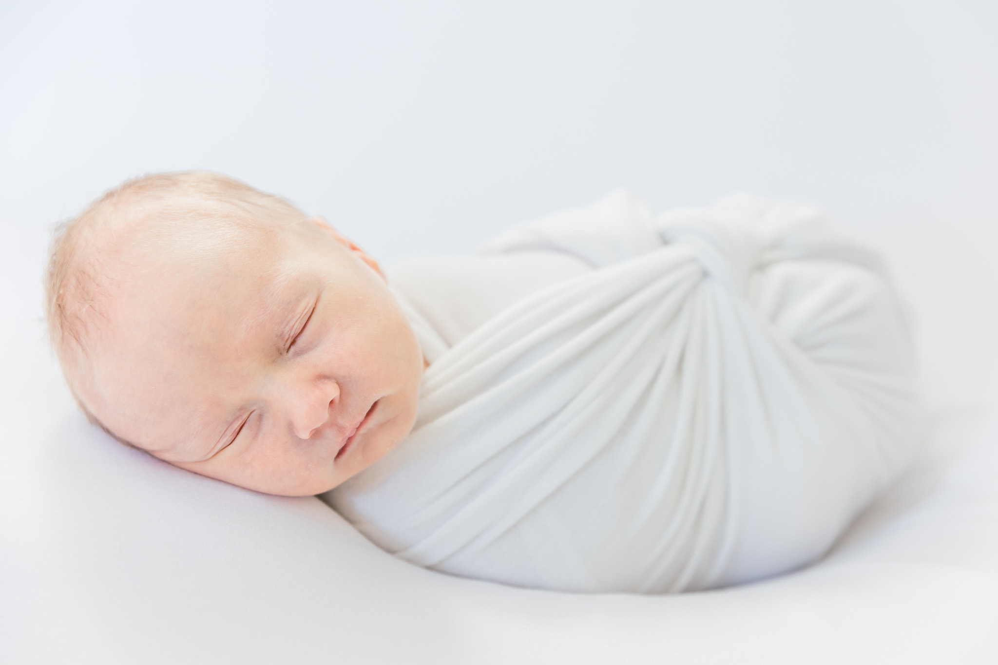 Swaddled newborn baby