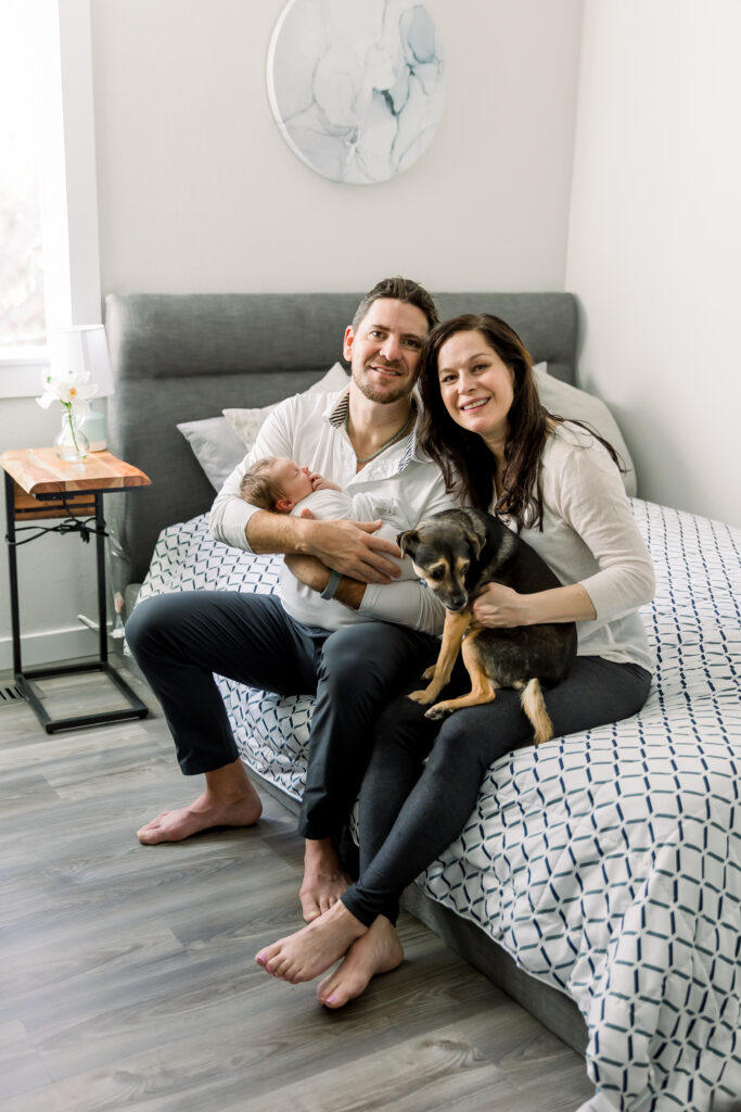 Family picture including, mom, dad, baby and dog