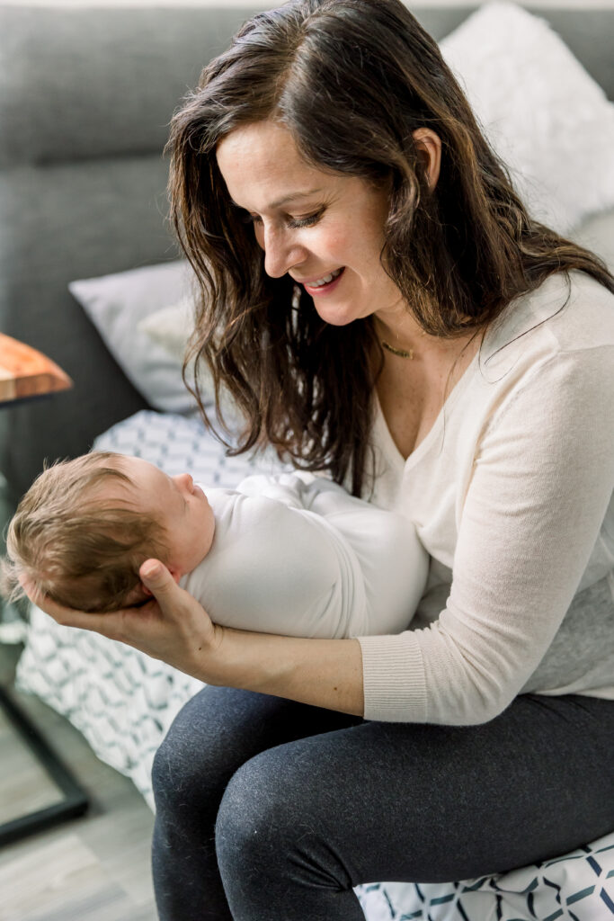 Mom holding baby from newborn session