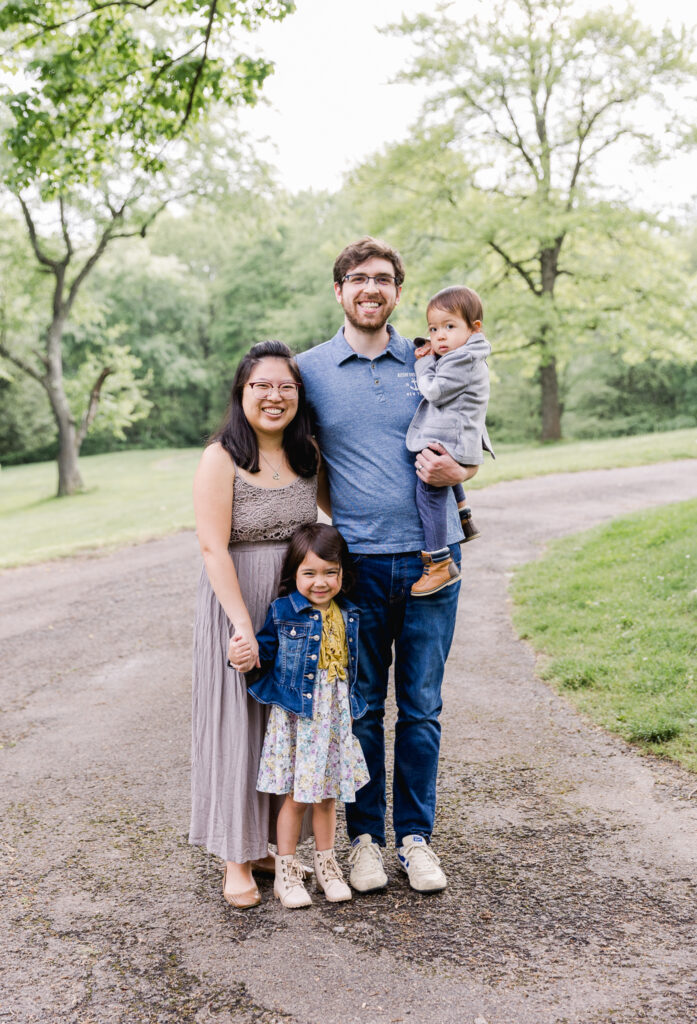 Photograph of family in the spring all looking at the camera 